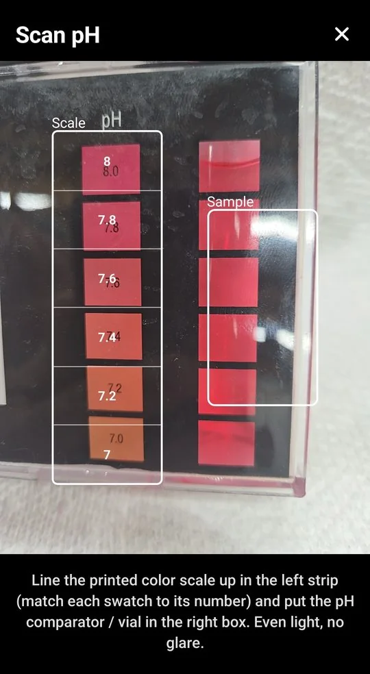 The app's Scan pH screen, with a pH test kit's printed color scale lined up in the left guide and the water sample in the right box